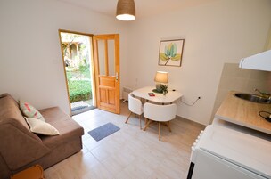 Comfort Apartment | Living area | Flat-screen TV