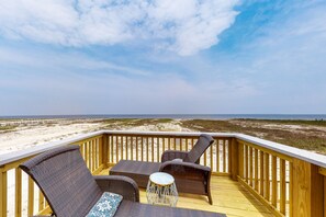 Enjoy the tranquil beachside views from this deck with a clear view of the ocean.