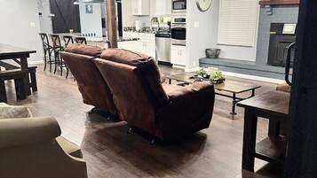 Smart TV, fireplace, books, computer monitors