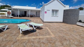 A pool area with lounge chairs, a lifebuoy, and a building labeled "CASA PABLO". - Luxury 3-Bedroom Villa with Private Pool in Los Mojones, Puerto del Carmen (VV) (Puerto del Carmen)