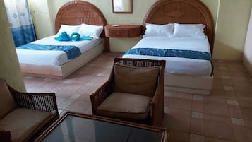 Desk, laptop workspace, iron/ironing board, bed sheets