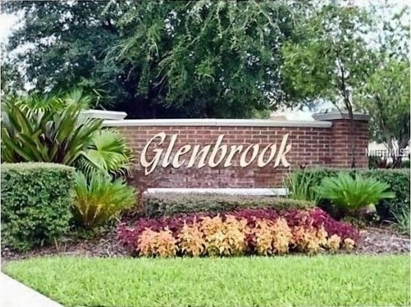 A brick wall with the name 'Glenbrook' in large letters.