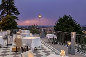 Lunch, dinner served; local and international cuisine, garden views 