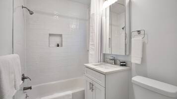 Combined shower/tub, hair dryer, towels, soap