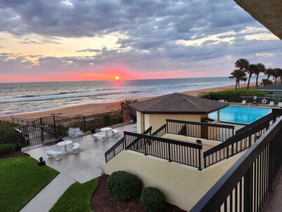 Actually on the beach! Step off balcony onto the beach & pool! Rare Find!!