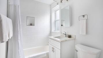 Combined shower/tub, hair dryer, towels, soap