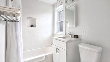 Combined shower/tub, hair dryer, towels, soap