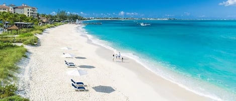 On the beach, sun loungers, beach towels