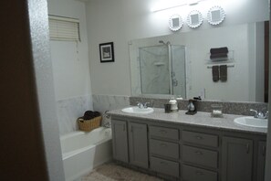 Combined shower/tub, hair dryer, towels, soap