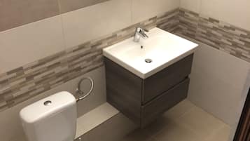 Shower, rainfall showerhead, towels