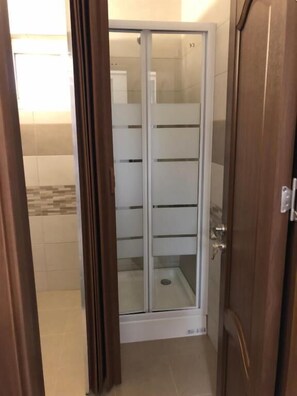 Shower, rainfall showerhead, towels