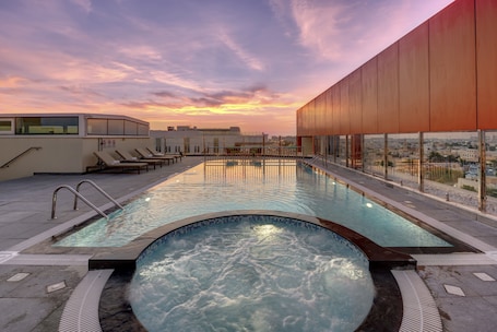 Outdoor pool, open 8:00 AM to 8:00 PM, pool umbrellas, sun loungers