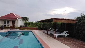 Outdoor pool, pool umbrellas, sun loungers