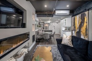 TV, fireplace - Downtown Waterfront Loft - Prime Location! (Kelowna)