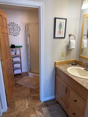 Shower, hair dryer, towels, shampoo