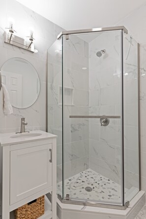 Shower, hair dryer, towels, soap