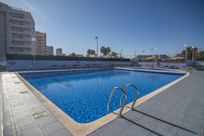 A heated pool, pool loungers