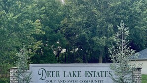 A sign for Deer Lake Estates, indicating it is a golf and swim community. - Golf Getaway-Large Families Welcome! Only 10 minutes from the Airport!  (Springfield)