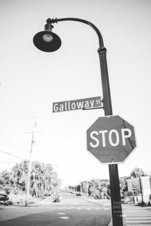 A street sign with "Galloway St" and a stop sign.