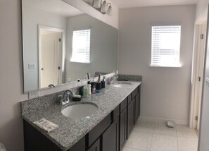 Combined shower/tub, hair dryer, towels, soap