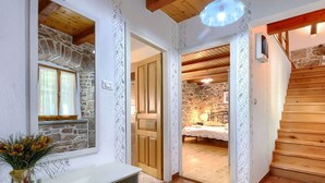 A rustic interior with a stone wall, wooden staircase, and a bed in a cozy room. - Beautiful private villa for 7 people with WIFI, A/C, private pool, TV and patio (Pazin)