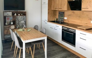 Fridge, stovetop, dishwasher, coffee/tea maker