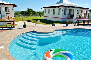Outdoor pool, pool umbrellas, sun loungers