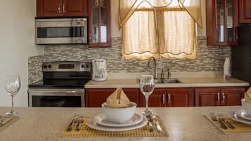 Villa | Private kitchen | Full-sized fridge, oven, stovetop, electric kettle