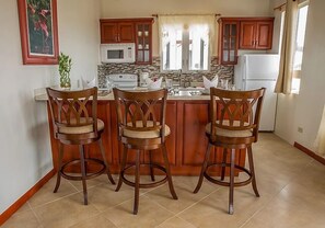Villa | Private kitchen | Full-size fridge, oven, stovetop, electric kettle