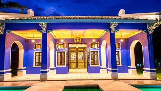 A building with a pool in front, featuring a traditional architectural style with arched windows and a central entrance. - OYO Bulan Anda Baba Resort (Ao Luek)