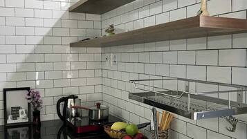 City Studio | Private kitchen | Fridge, microwave, cookware/dishes/utensils, dining tables