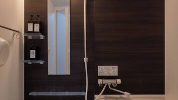 Separate bathtub and shower, free toiletries, hair dryer, slippers