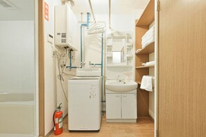 Apartment | Bathroom | Separate bathtub and shower, slippers, electronic bidet, towels