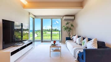 Condo | Living room | 65-inch flat-screen TV with digital channels, LCD TV