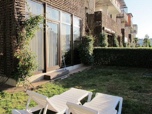 Guests can enjoy a balcony with a garden view and access to a well-maintained lawn.