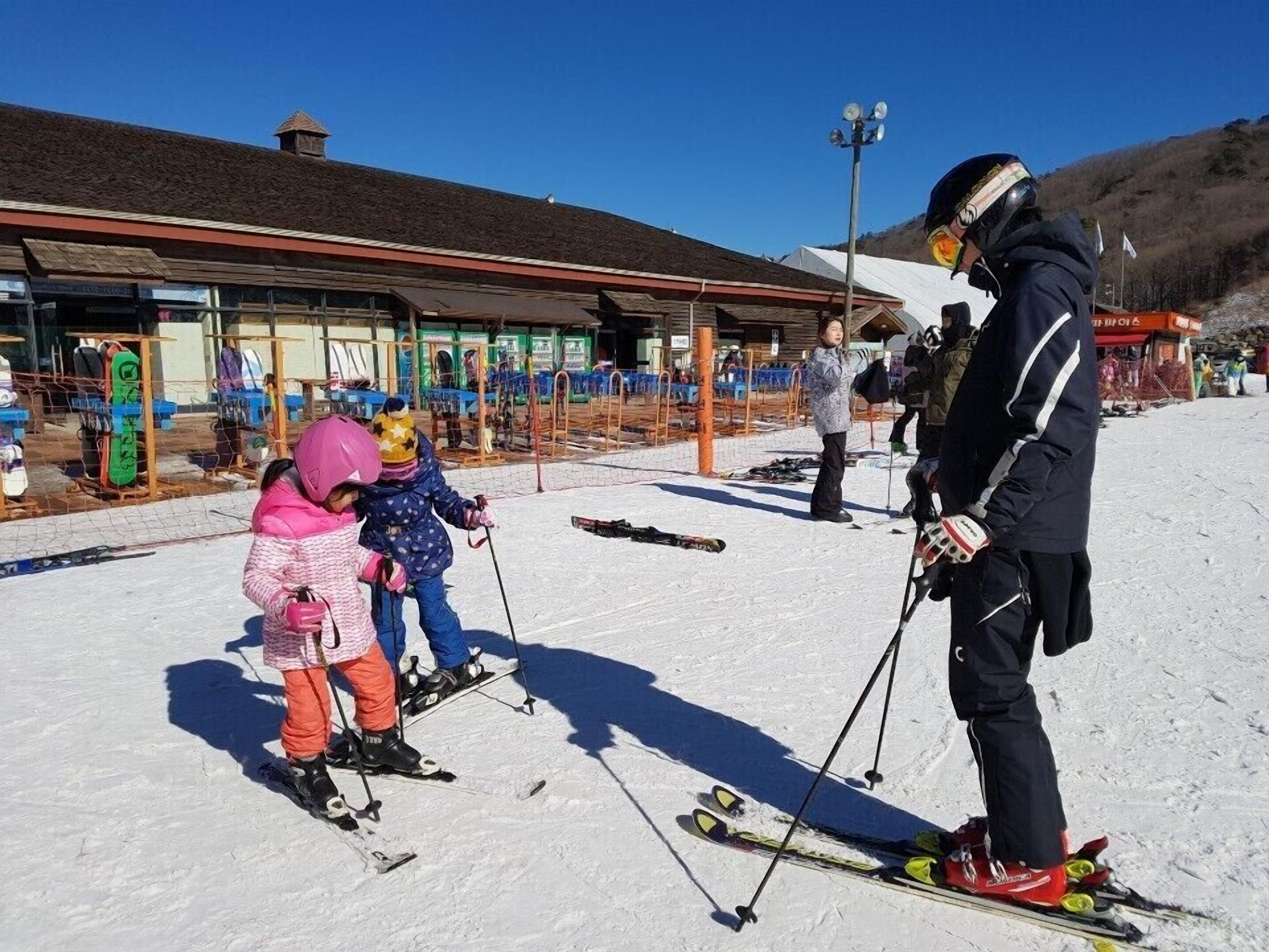 A ski resort with a covered area and ski equipment.