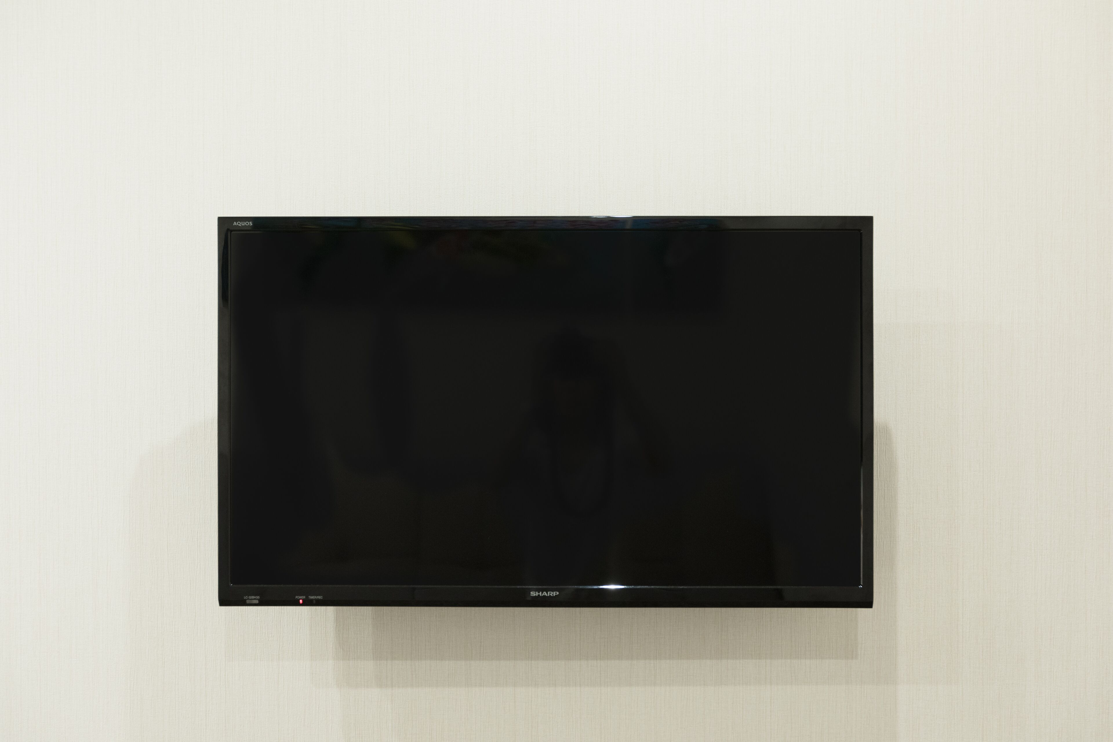 A flat-screen TV mounted on a wall.