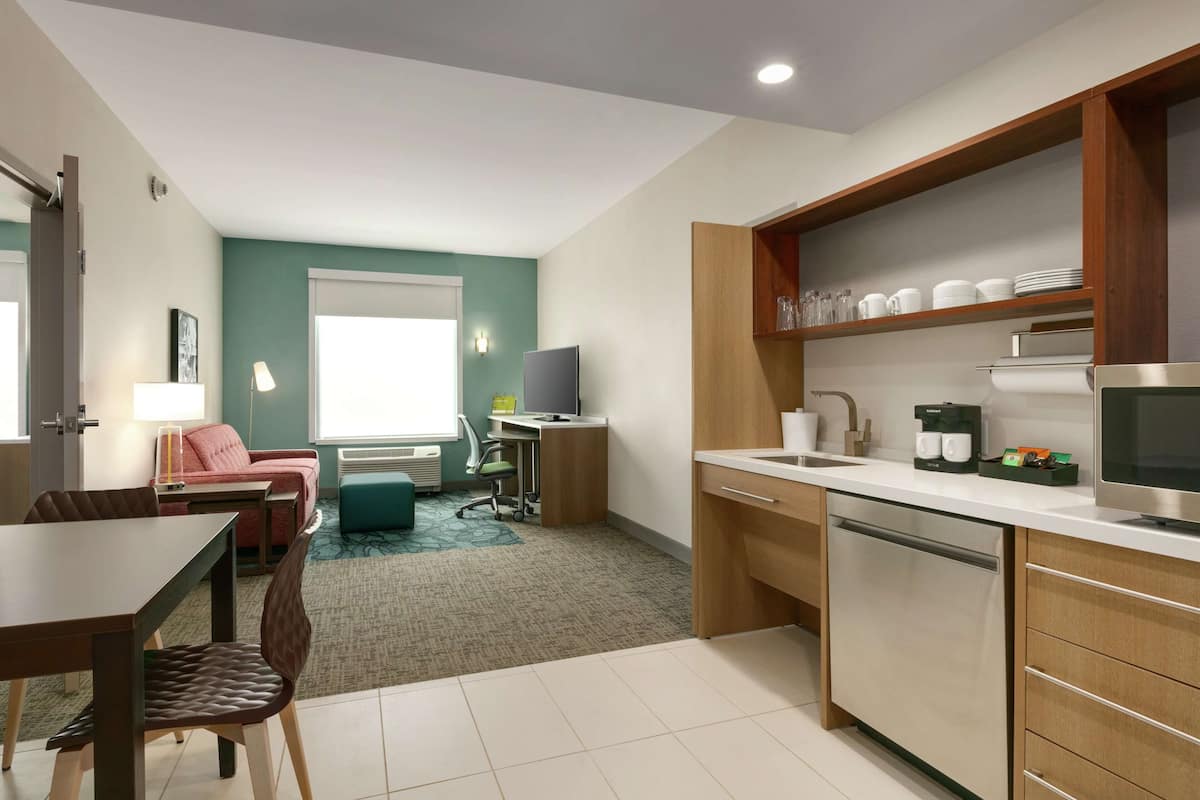 Suite, 1 King Bed, Accessible (Roll-In Shower) | Desk, laptop workspace, blackout drapes, iron/ironing board