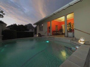 Seasonal outdoor pool, pool umbrellas, pool loungers