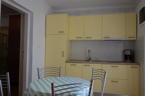 Apartment, 1 Bedroom | Private kitchen | Fridge, stovetop, coffee/tea maker, cookware/dishes/utensils