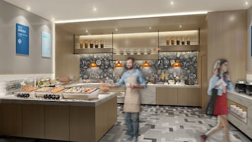 Uma cozinha moderna com uma ilha central, iluminação pendente e painel decorativo atrás do fogão.