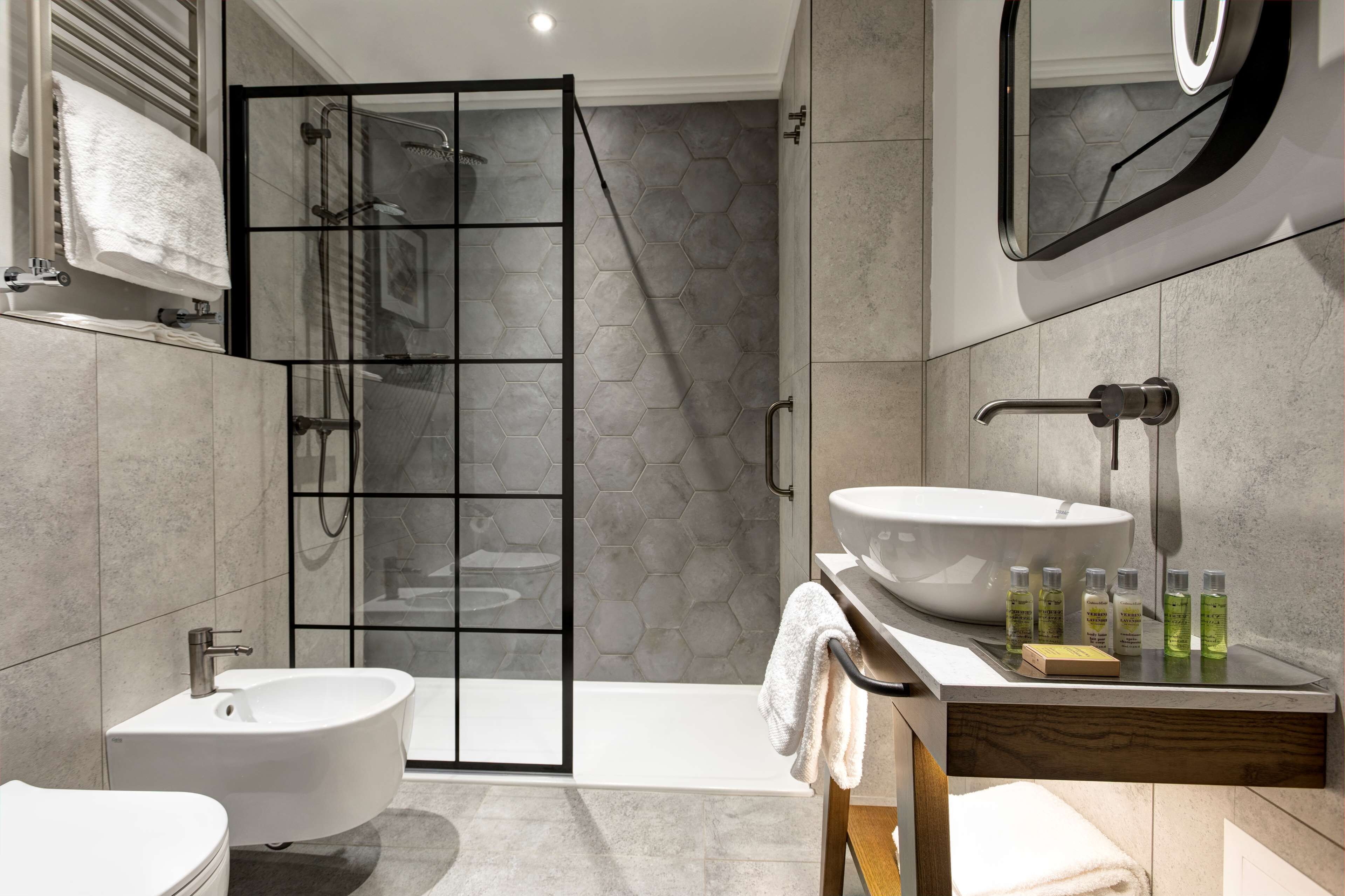 hair dryer, slippers, bidet, towels