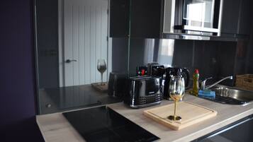 Fridge, microwave, stovetop, coffee/tea maker