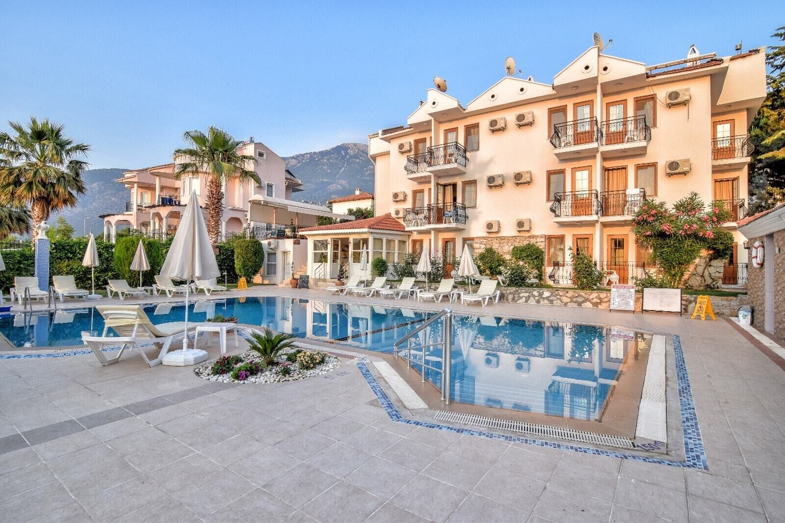 Outdoor pool, pool umbrellas, sun loungers