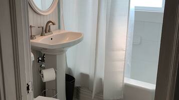 Combined shower/bathtub, hair dryer, towels, toilet paper