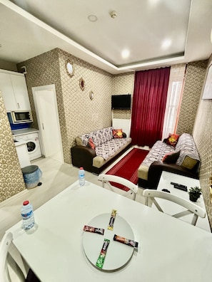 Deluxe Apartment, 1 Bedroom | Living area | 82-cm plasma TV with satellite channels, TV - Beyaz Suites & Hotel (Istanbul)