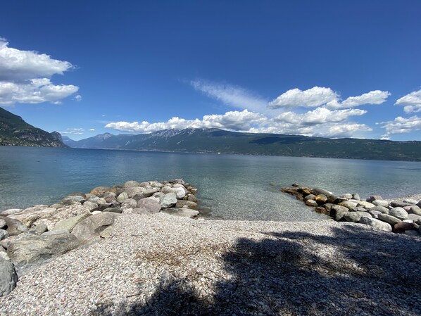 On the beach, sun-loungers