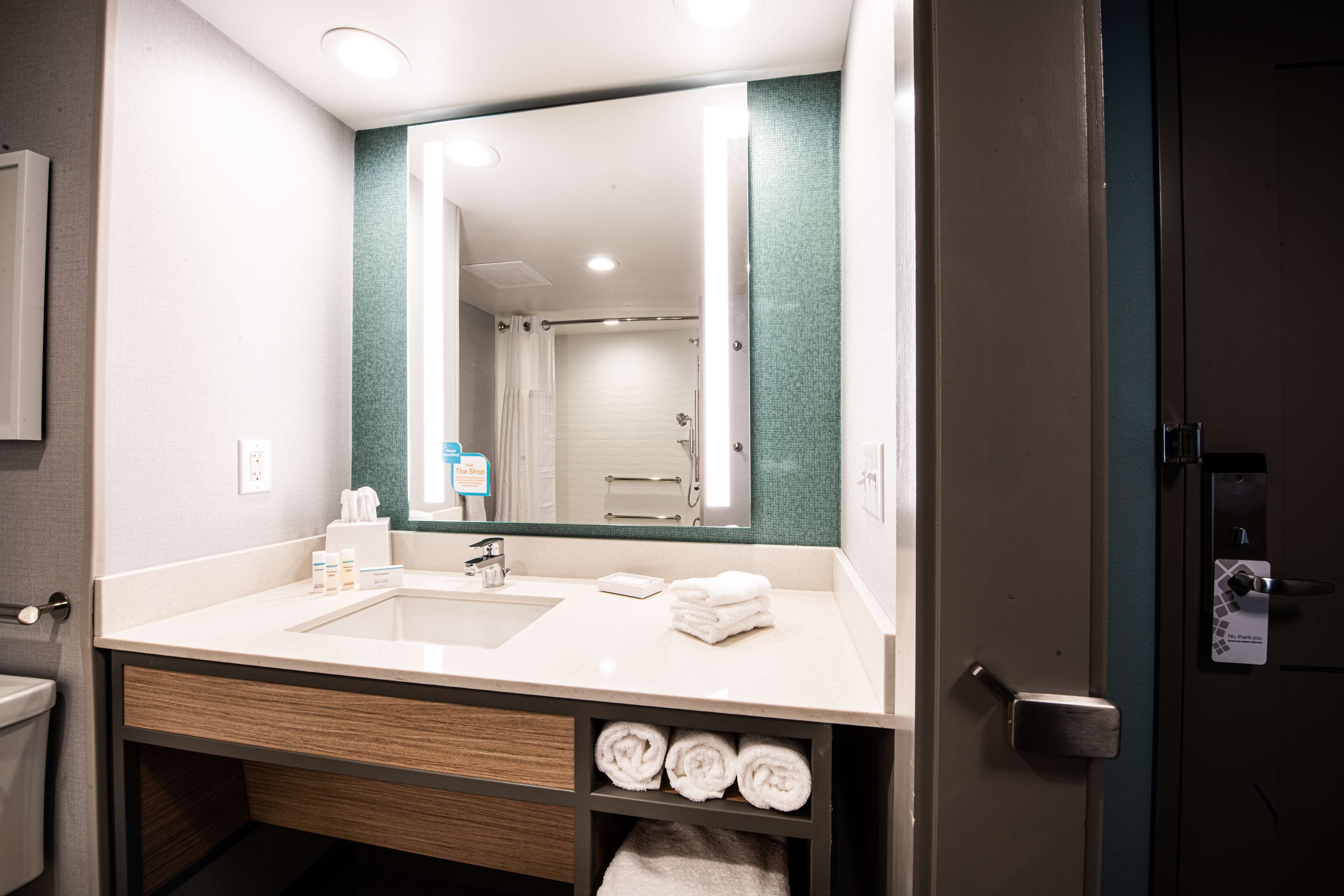 designer toiletries, hair dryer, towels, soap