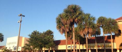 A commercial building with a fitness center and a shoe store.