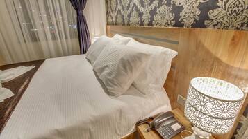 Premium bedding, memory-foam beds, minibar, in-room safe